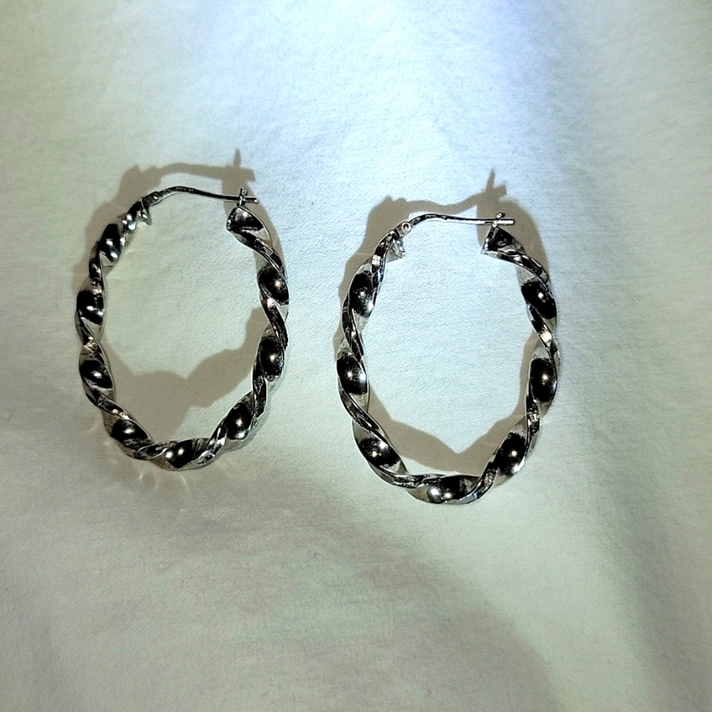 OVAL Twisted hoops earrings.